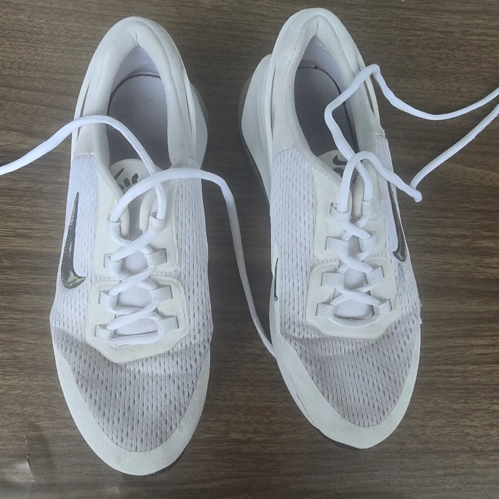 White Nike Sneakers with Black Swoosh